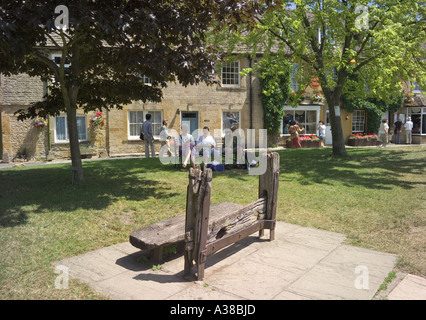 The old stocks in the Market Square at the Cotswold town of Stow on the Wold, Gloucestershire Stock Photo