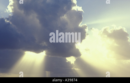 Sun clouds and sun rays rays bursting through clouds Stock Photo
