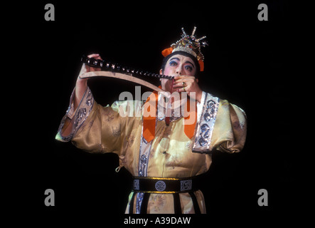 1, one, Chinese man musician playing ancient music on stage at Tang Dynasty Theater in the capital city of Xian in Shaanxi Province in China Stock Photo