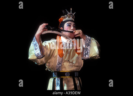 1, one, Chinese man musician playing ancient music on stage at Tang Dynasty Theater in the capital city of Xian in Shaanxi Province in China Stock Photo