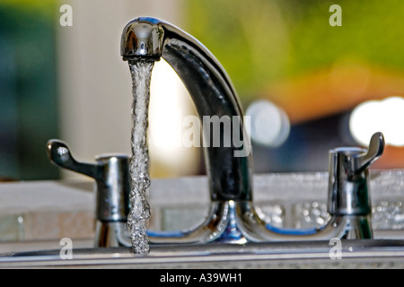 Water running from a kitchen mixer tap Stock Photo