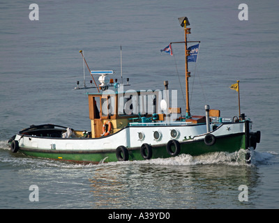 Little old tug boat now a recreational vessel in the port of Rotterdam the Netherlands Stock Photo