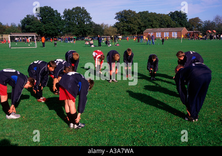 Boys' football team warming up before a match Stock Photo