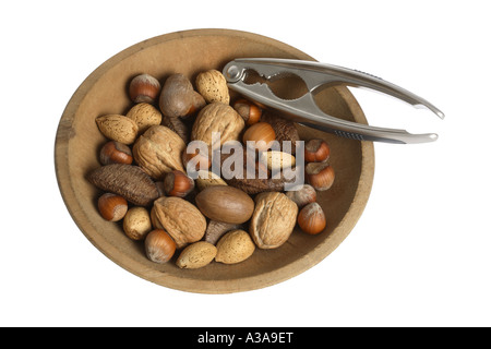 Nuts in Wooden Bowl with Nutcracker Stock Photo