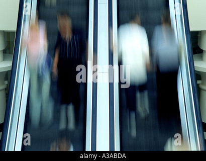 People on escalator Stock Photo