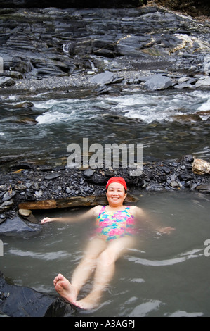 people enjoying natural hot river water of Tona hotspring bath resort valley scenery Maolin Kaoshiung County Taiwan China Stock Photo