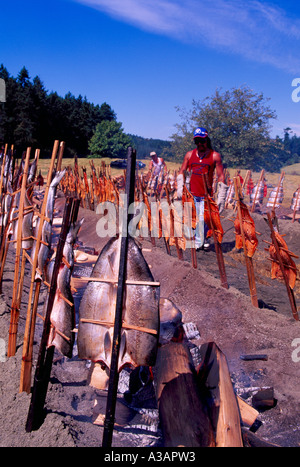 Wild Salmon Bake / Barbecue - Traditional Native Indian Style cooking over Alder Wood in Open Fire Pit, British Columbia, Canada Stock Photo