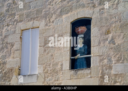 Woman at the window (painted) Saint Emilion, Gironde, France Stock Photo