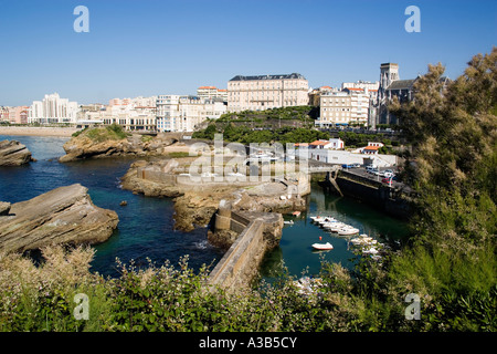 FRANCE Aquitaine Pyrenees Atlantique Biarritz Port des Pecheurs Fishing boat harbour with view to Grande Plage beach and hotels. Stock Photo