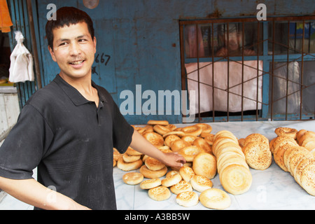 Baker Selling Bread Stock Photo