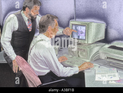 Two businessmen working on computer together Stock Photo
