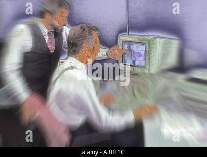 Two businessmen working on computer together Stock Photo