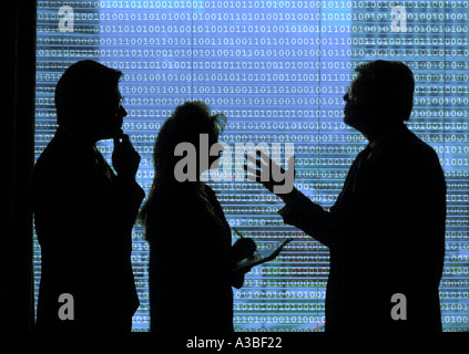 Silhouette of businessmen and businesswoman having meeting Stock Photo