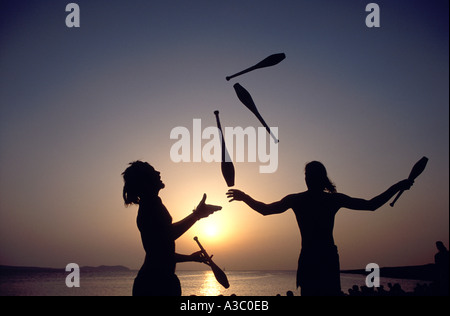 Juggling at sunset at the Cafe del Mar in San Antonio, Ibiza, Spain Stock Photo