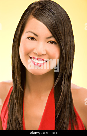 20's Asian woman happily smiling in a summer dress. Stock Photo