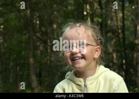 The girl in glasses laughing. Stock Photo