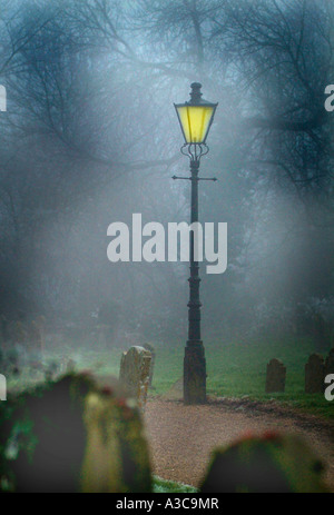 lamp post in churchyard Stock Photo