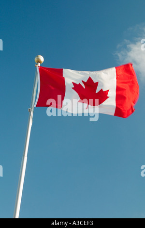Canadian Flag against Blue Sky Stock Photo