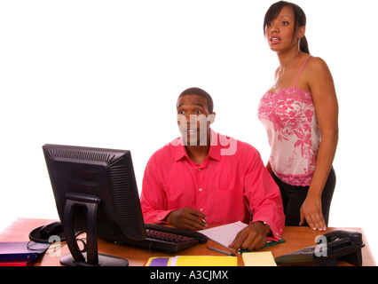 African American male executive with co-worker surprised while going over some files in the office Stock Photo
