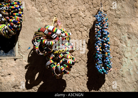 Bracelets hanging on an adobe wall in Djenne, Mali, West Africa Stock Photo