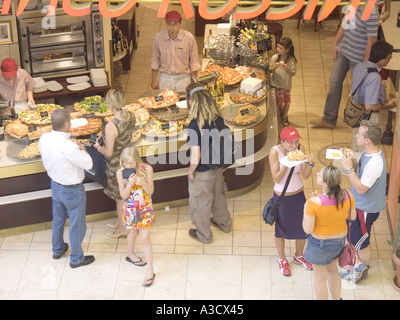 Family eating pizza in a shopping mall Munich Bavaria Germany Stock Photo