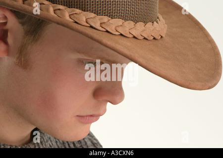 Male teenager wearing a leather Stetson hat Stock Photo