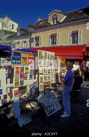 French people artist painting in the Place du Tertre Montmartre District Paris Ile-de-France region France Europe Stock Photo