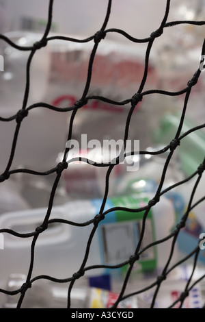 netting  retaining a pile of blurred empty plastic bottles Stock Photo