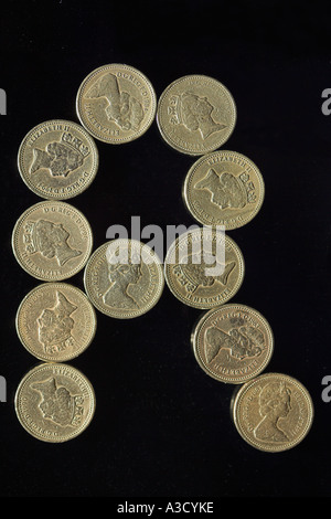 BRITISH POUND COIN FONT LETTER R ON BLACK Stock Photo