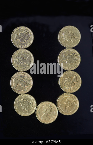 BRITISH POUND COIN FONT LETTER U ON BLACK Stock Photo