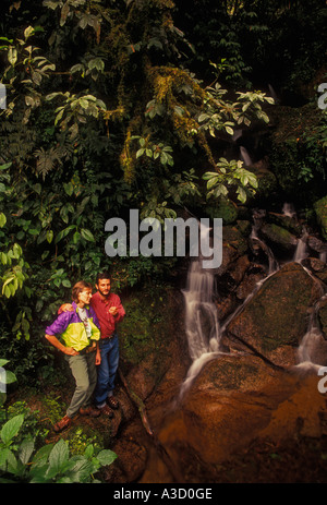 Brazilian man, Brazilian woman, couple, naturalist, hikers, hiking trail, Atlantic Rainforest, Itatiaia National Park, Rio de Janeiro State, Brazil Stock Photo