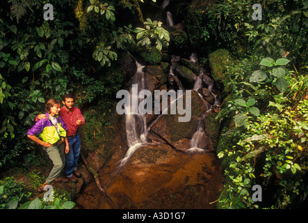 Brazilian man, Brazilian woman, couple, naturalist, hikers, hiking trail, Atlantic Rainforest, Itatiaia National Park, Rio de Janeiro State, Brazil Stock Photo