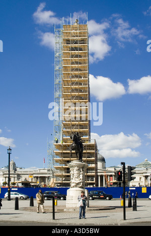 Statue of Charles 1 on horseback in front of scaffold tower around Nelsons column to provide safe access to cleaning & repair work Trafalgar Square UK Stock Photo