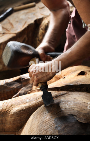 Environmental Portrait Of Wood Carver With Hammer And Chisel, Making 