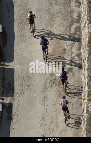 Cyclists peddling up the highest road in the Alps to the mountain pass of Stilfserjoch, South Tyrol, Italy Stock Photo