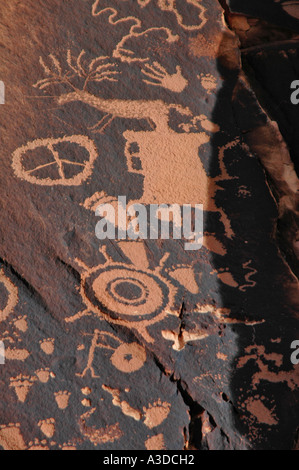 Newspaper Rock is a petroglyph panel etched in sandstone that records approximately 2 000 years of early man s history Stock Photo