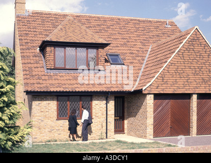 Young couple viewing unoccupied just built new detached house for sale Stock Photo