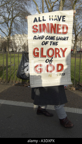 Man holding a Christian banner at the Speaker s corner Hyde Park London Stock Photo