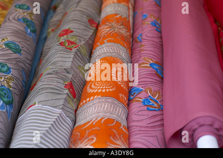 Colourful rolls of material in fabric shop in Southall London Stock Photo