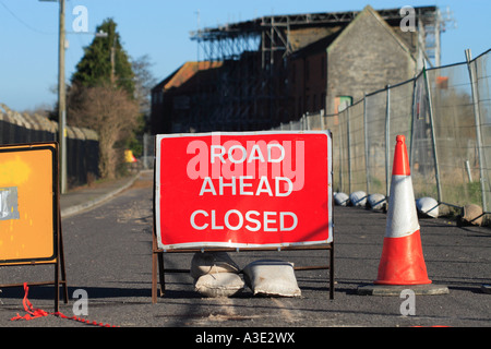 Road Ahead Closed sign board blocking street access to all vehicles Stock Photo