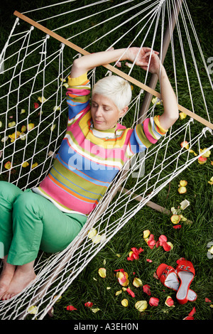 High angle view of a mature woman sleeping in a hammock Stock Photo