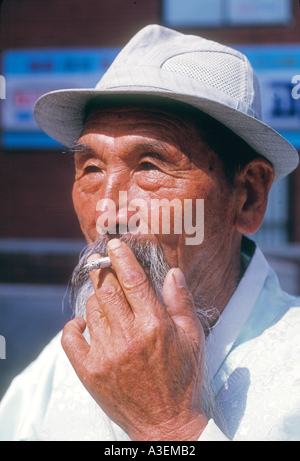 Chejudo cheju island south korea south korea asia asian oriental travel lifestyle destination holiday old man adult smoke smokin Stock Photo