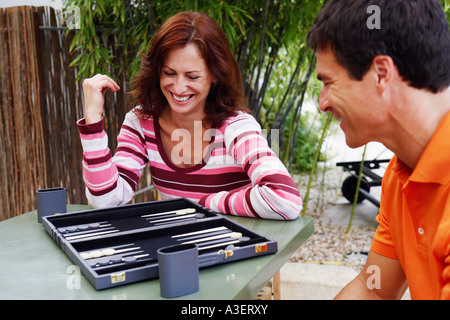 Mature couple playing backgammon Stock Photo