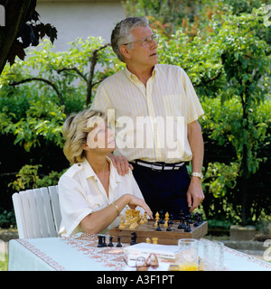 MR MATURE COUPLE'S PORTRAIT IN GARDEN Stock Photo