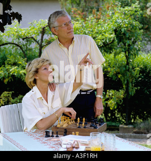 MR MATURE COUPLE'S PORTRAIT IN GARDEN Stock Photo