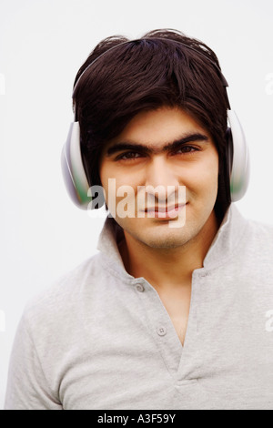 Portrait of a young man wearing headphones Stock Photo