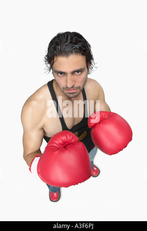 High angle view of a young man wearing boxing gloves Stock Photo