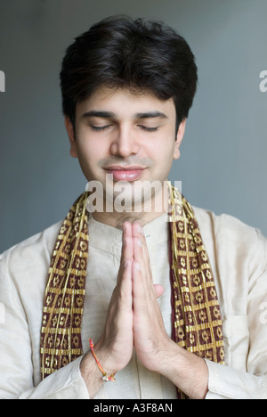 Close-up of a young man in a prayer position Stock Photo
