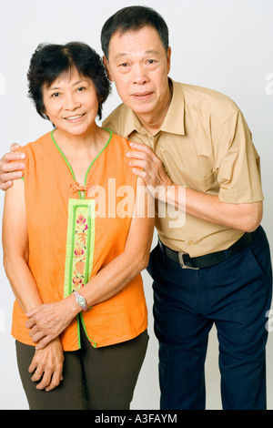 Portrait of a senior man and a mature woman standing Stock Photo