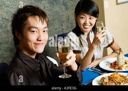 Close-up of a young couple holding glasses of champagne Stock Photo